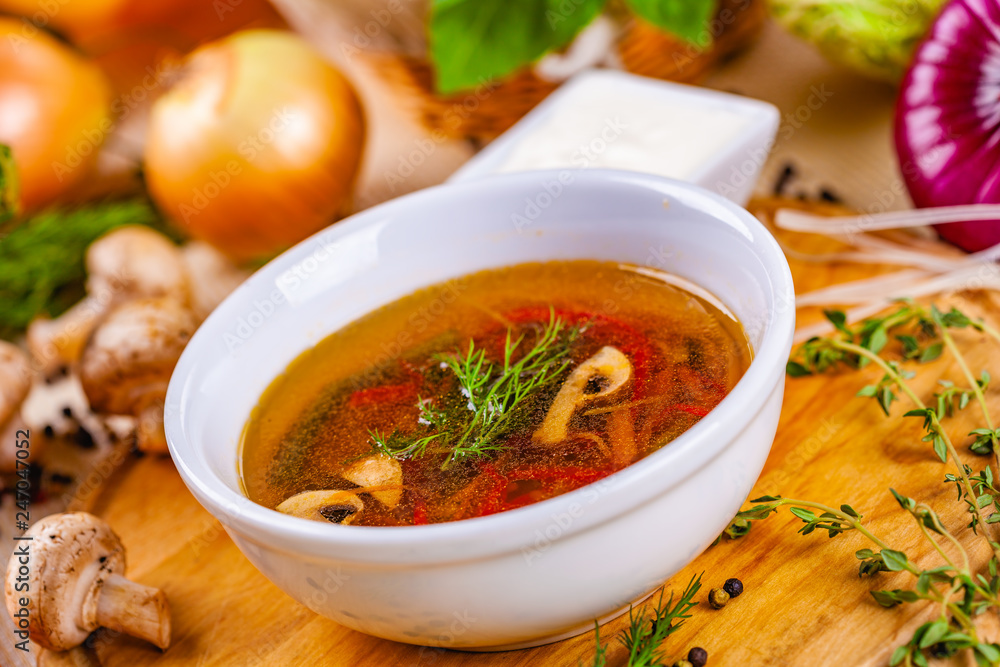 Vegetable soup with herbs and spices in white plate Vegetable soup with herbs and spices in white plate