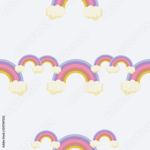 Cute rainbow pattern. Rainbow escaping from two clouds