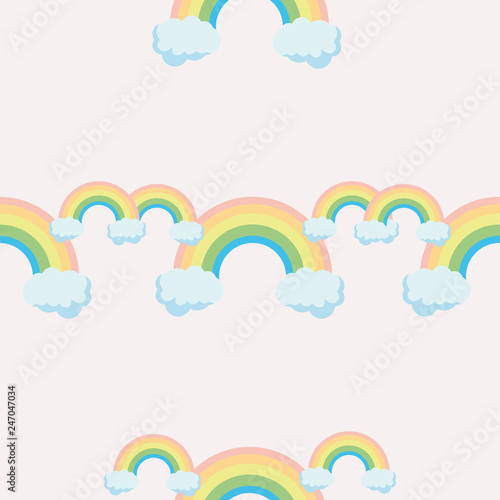 Cute rainbow pattern. Rainbow escaping from two clouds