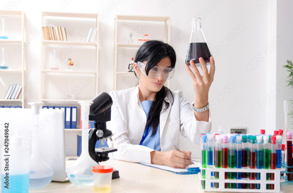 Female chemist working at the lab Female chemist working at the lab