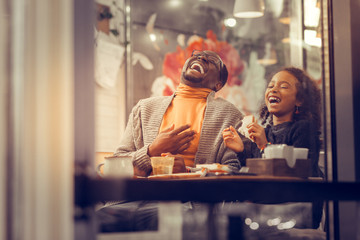 Father and daughter laughing out loud feeling happy together