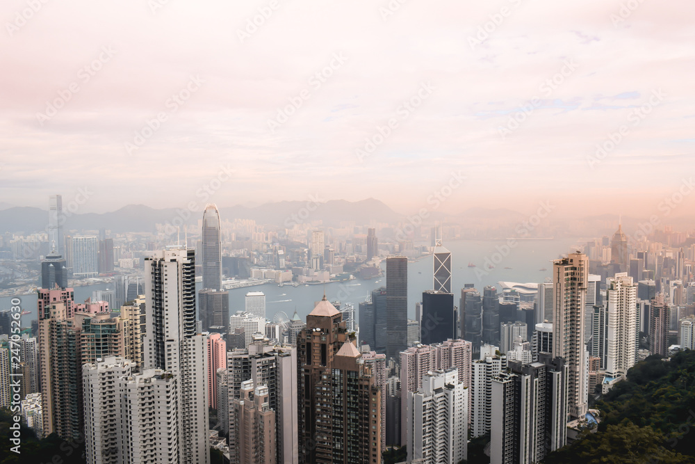 Beutiful pink sunset view on the Hong Kong skyline and the Victoria Harbour from the Peak