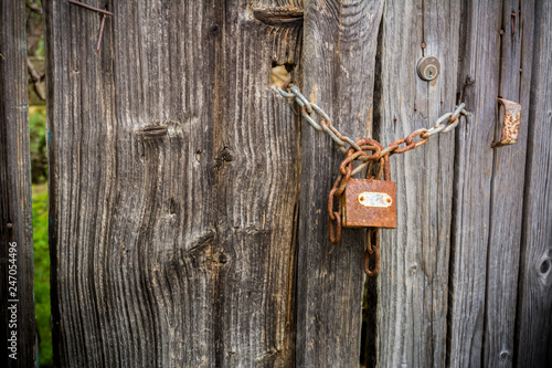 Old Wooden Doorway Secured with a Padlock