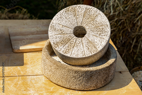 millstone stone grain grinding flour production handmade traditional way with antiquity photo