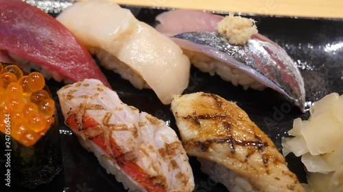 Edomae-zushi (sushi shaped by hand; Nigiri-zushi ) top view, filmed in 4K photo