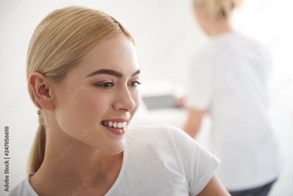 Fototapeta premium Attractive young woman with perfect skin expressing positive emotions