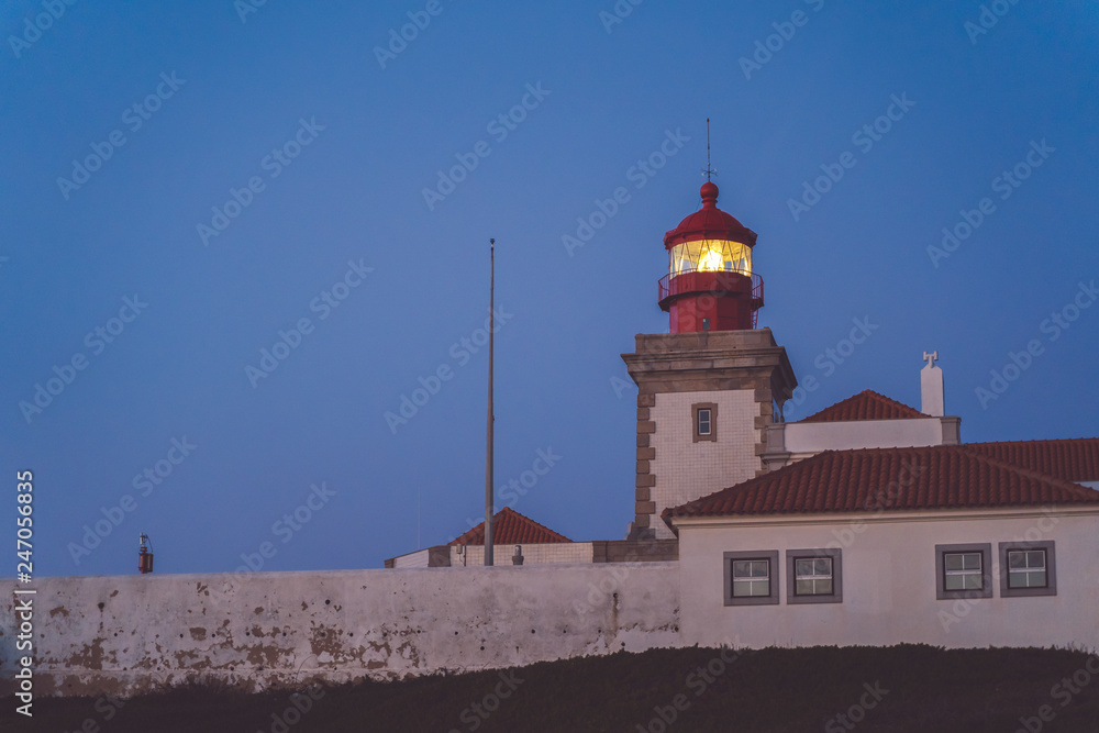 Cape Roca lighthouse (Cabo da Roca). Blue night sky and atlantic ocean, Westernmost Europe.