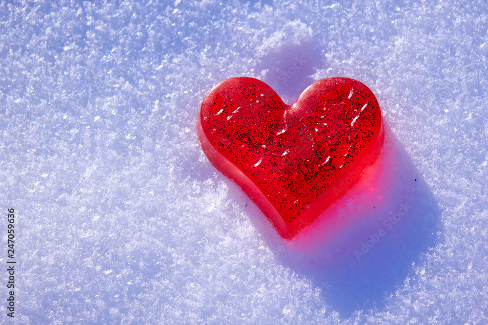 Beautiful red heart in the snow. Handmade soap in the shape of a heart. Love and Valentine's Day concept. Romantic background with free space for text. Beautiful red heart in the snow. Handmade soap in the shape of a heart. Love and Valentine's Day concept. Romantic background with free space for text.