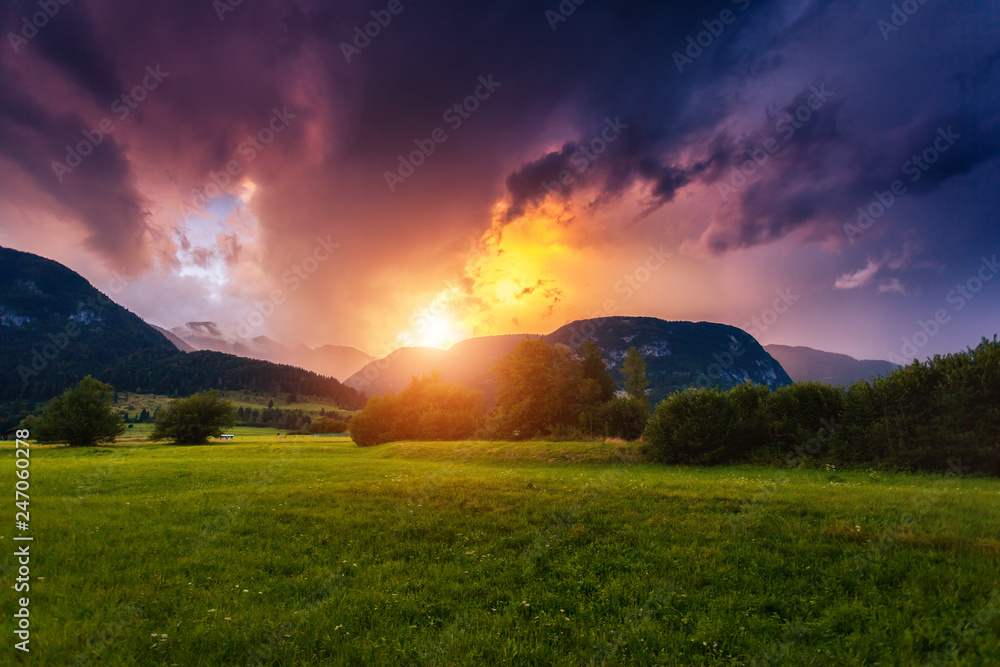 Fototapeta premium Wonderful view of green fields with hills. Location place Triglav national park, Bohinj valley, Julian Alps, Slovenia, Europe.