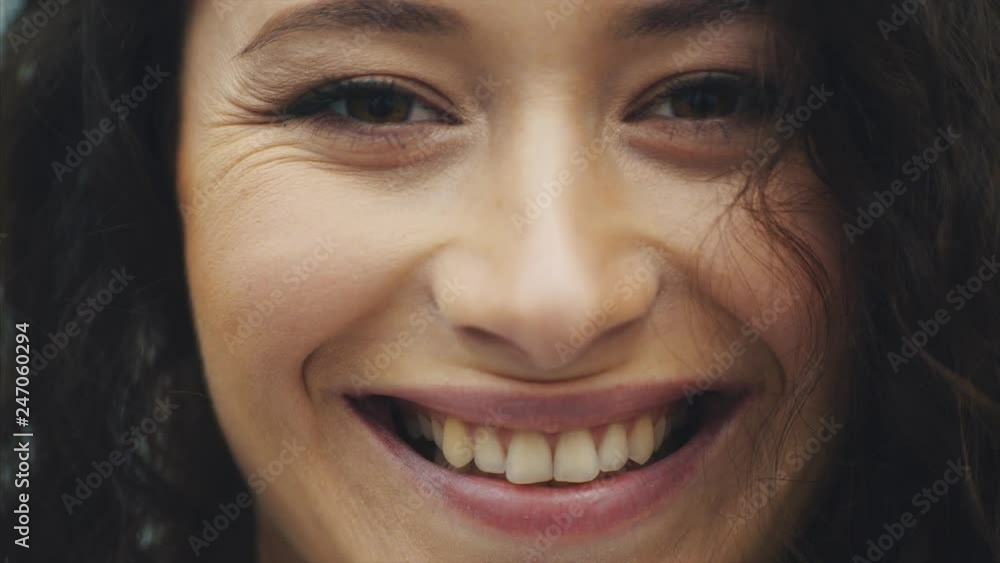 Portrait of a beautiful young brunette. A light-skinned girl with shaggy hairstyles smiling fun. Portrait of a beautiful young brunette. A light-skinned girl with shaggy hairstyles smiling fun.