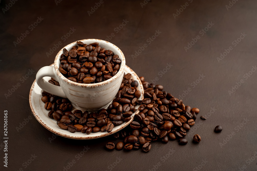 Coffee cup and beans on a concrete table Coffee cup and beans on a concrete table
