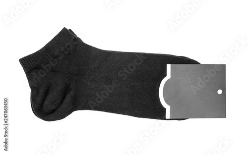 Black socks with tag on white background..