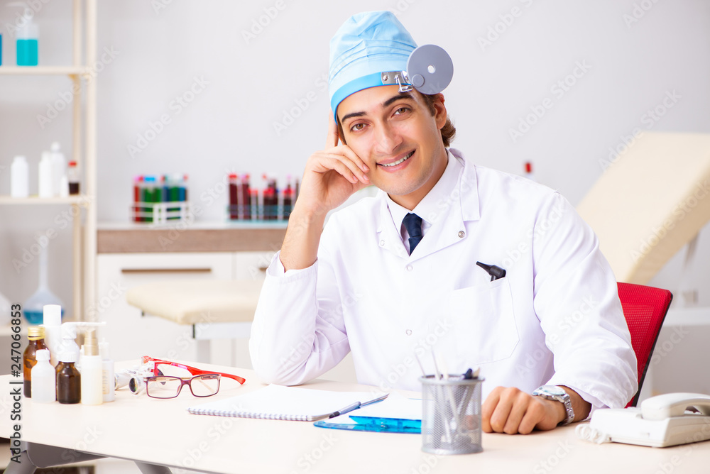 Young male doctor otolaryngologist working at the hospital Young male doctor otolaryngologist working at the hospital