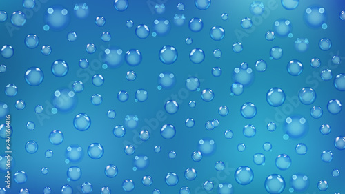 Background of bubbles or water drops of different sizes in light blue colors