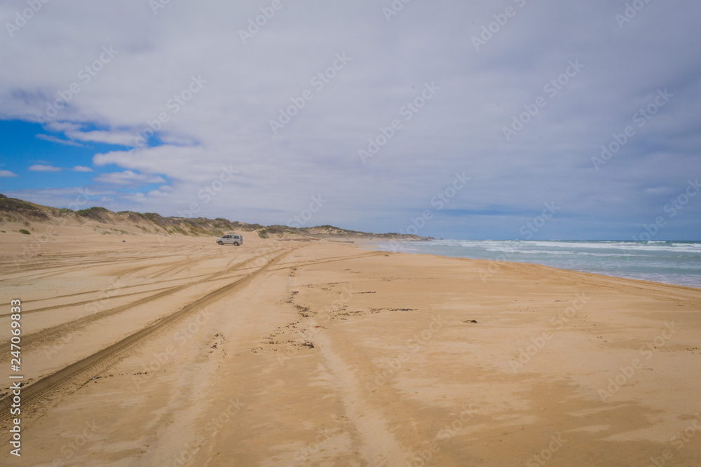 Australia sand beach landscape with offroad car Australia sand beach landscape with offroad car