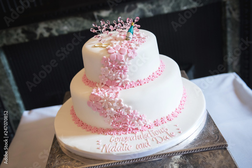 White wedding cake with delicate floral design
