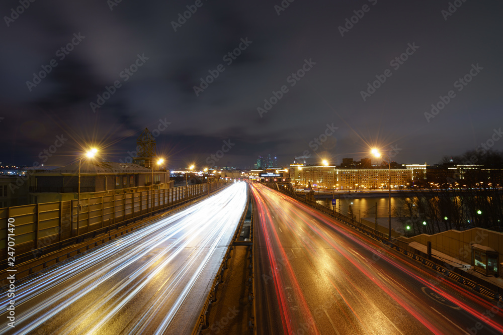 Winter city highway at night time. Long exposure image.