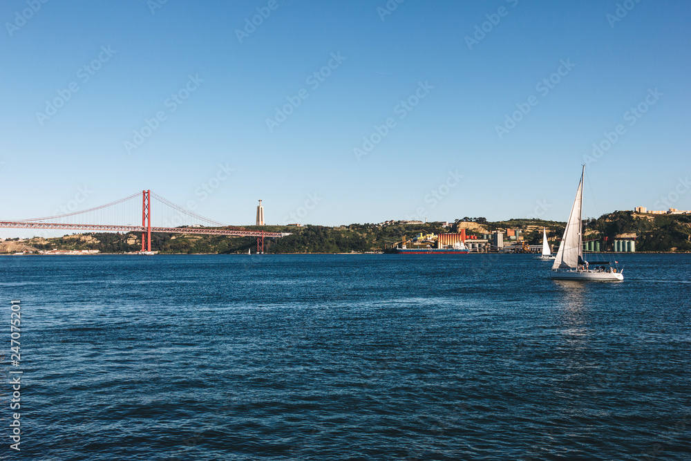 The Christ the King statue and 25 April bridge over the Tagus river in Lisbon, Portugal