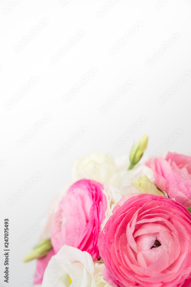 Ranunculus and lisiathus floral bouquet flat lay on white background Ranunculus and lisiathus floral bouquet flat lay on white background