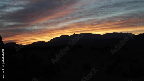 A time lapse of the light of dawn over the Waterpocket Fold in Capitol Reef National Park in Utah. photo