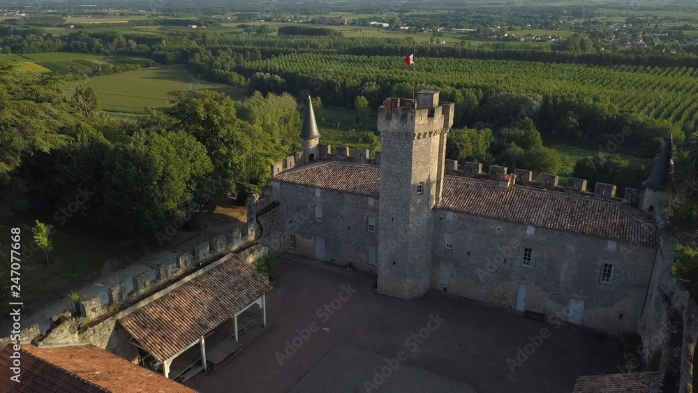 Castle of Sainte Croix du Mont at sunset, drone point of view