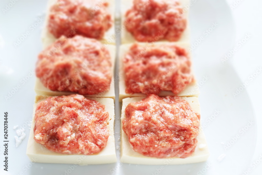 Chinese cooking, prepared mince meat on tofu Chinese cooking, prepared mince meat on tofu