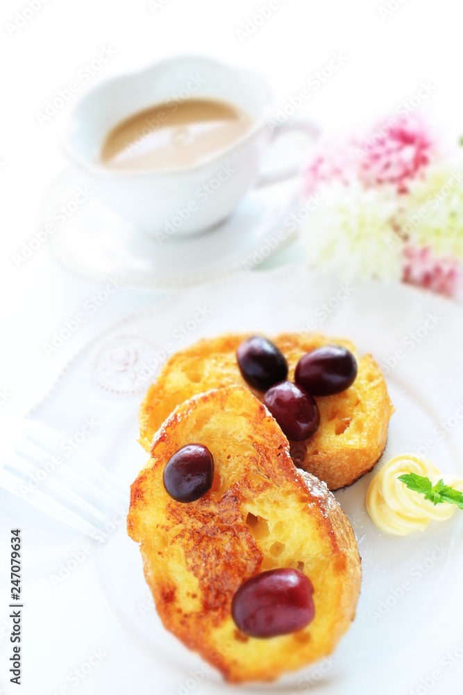 Homemade honey French toast served with grape Homemade honey French toast served with grape
