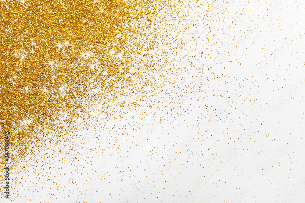 Bright beautiful shining golden glitter on white background, top view Bright beautiful shining golden glitter on white background, top view