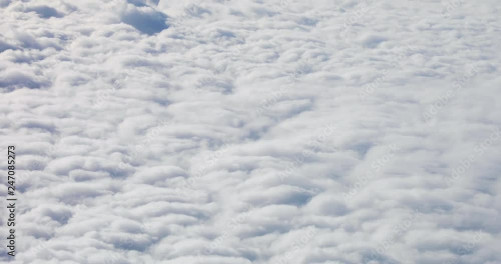 View of the wonderful fluffy white clouds and clear blue sky in sunny weather. View of the wonderful fluffy white clouds and clear blue sky in sunny weather.