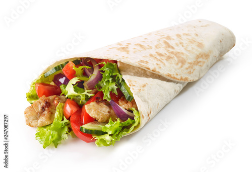 Tortilla wrap with fried chicken meat and vegetables photo