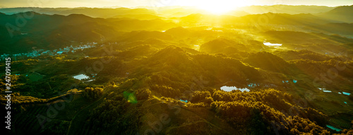 Fototapeta Naklejka Na Ścianę i Meble -  Aerial sunlight in the mountains at sunrise