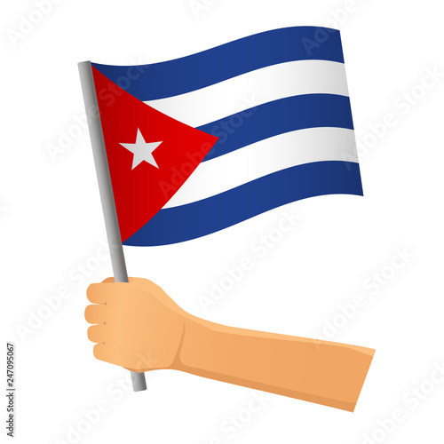 Cuba flag in hand © Visual Content