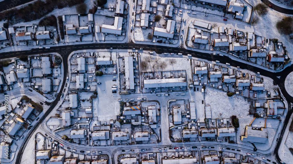 Top down aerial view of roads and houses covered in fresh snowfall (Ebbw Vale, Wales, UK)