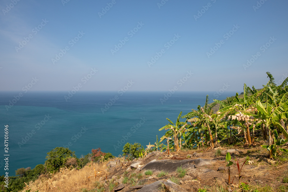 Sea aerial view,Top view,amazing nature background.The color of the water and beautifully bright.Azure beach with rocky mountains and palm trees and clear water of Thailand ocean at sunny day