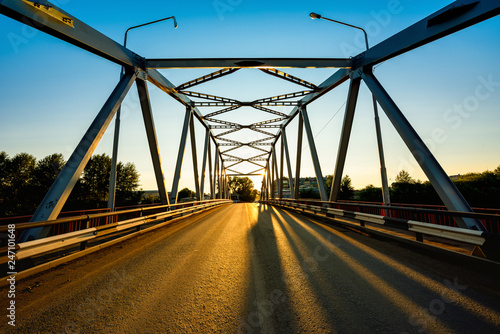 Fototapeta Naklejka Na Ścianę i Meble -  bridge over the river at sunset