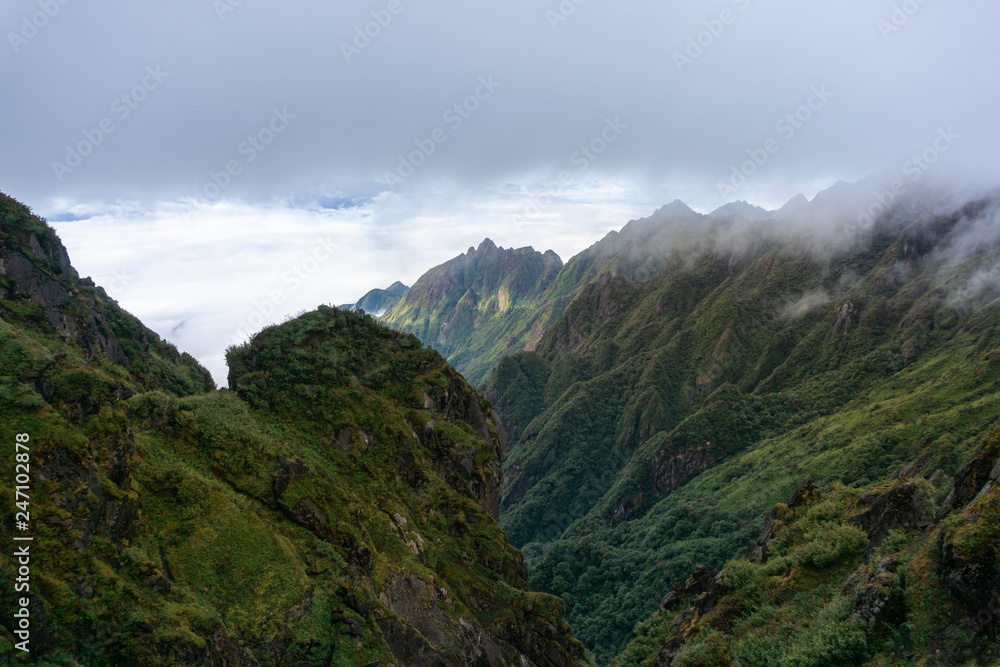 Fototapeta premium Mountain with clouds in Sapa town, southern Vietnam