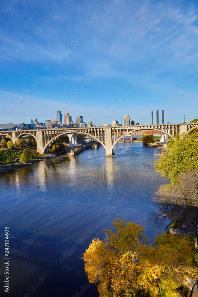 Concrete white arch bridge over the Mississippi River in Minneapolis, Minnesota USA Concrete white arch bridge over the Mississippi River in Minneapolis, Minnesota USA