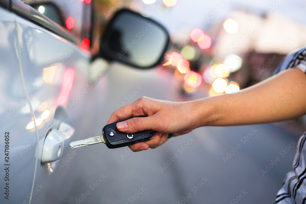 Hand of woman open with the key car. Hand of woman open with the key car.