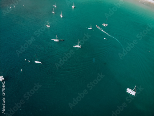 Aerial view of many anchoring yacht in open water. Ocean and sea travel and transportation © Semachkovsky 