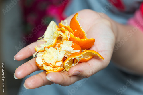 orange peel in hands