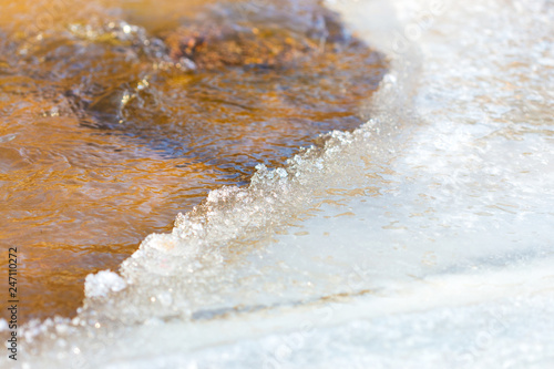 winter, frozen lake and streams of water