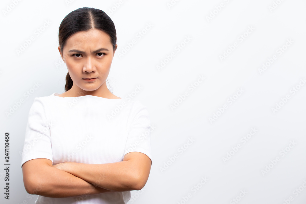Angry woman standing isolated over white background Angry woman standing isolated over white background