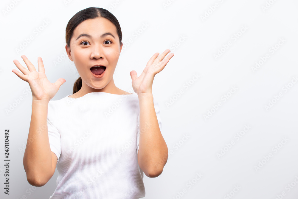 Happy woman with raised hands and celebrating standing isolated over white background Happy woman with raised hands and celebrating standing isolated over white background