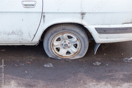 car wheel flat tire on the road © donikz