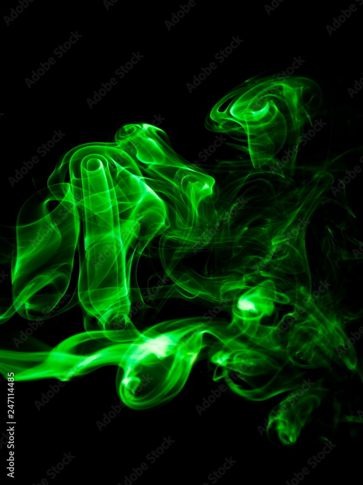Green smoke on black background Green smoke on black background