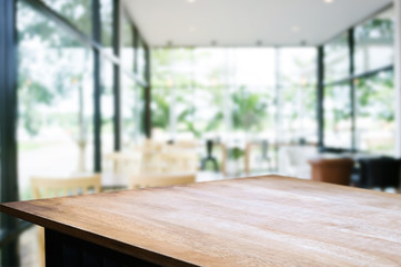 wooden table with blurred modern home background.