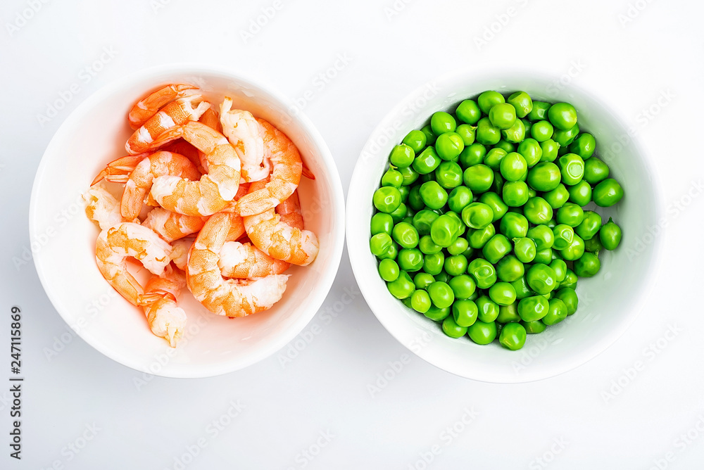 Prepare fresh ingredients for cooking - peas and shrimps Prepare fresh ingredients for cooking - peas and shrimps
