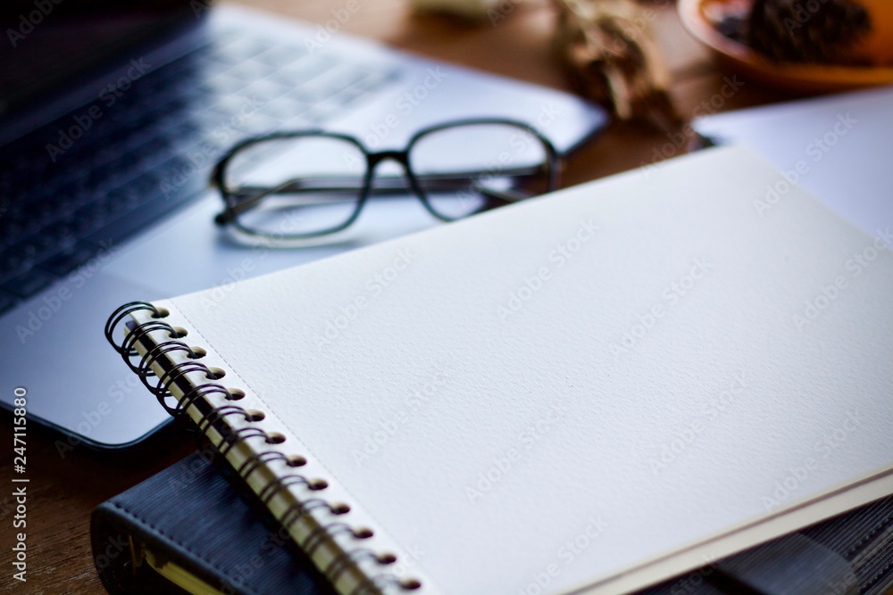 glasses and pen on a notebook glasses and pen on a notebook