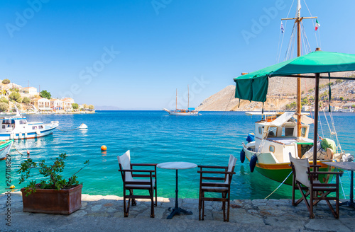 Fototapeta Naklejka Na Ścianę i Meble -  Traditional small street taverna in Symi island, Greece
