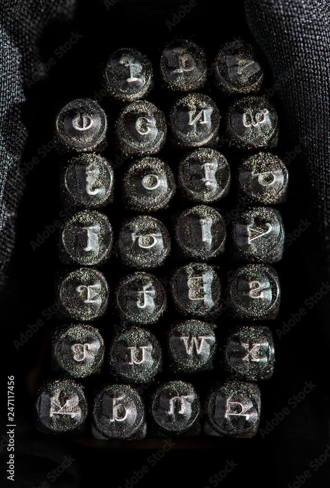 Metal letters of print cliches. Alphabet on metal embossed printing template. Metal letters of print cliches. Alphabet on metal embossed printing template.
